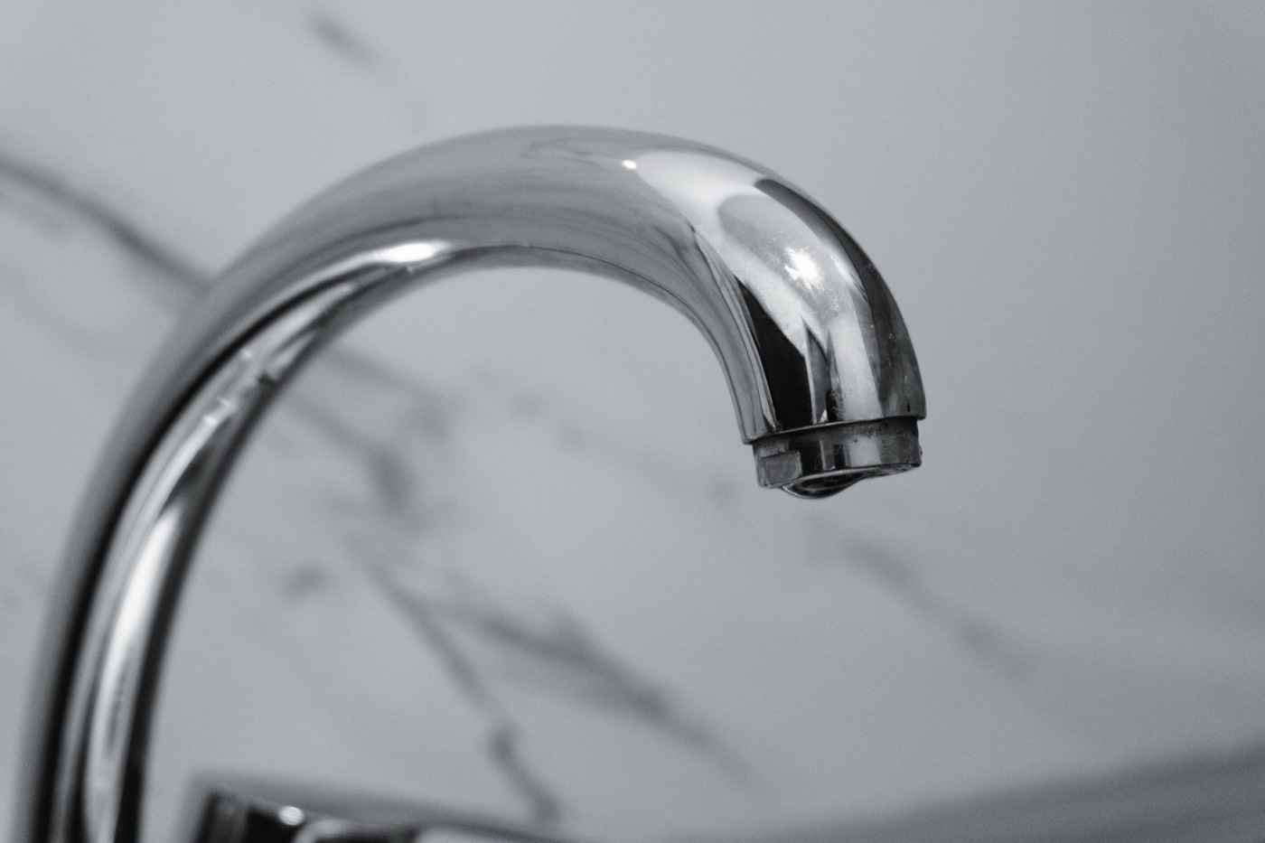 Premium chrome faucet against marble, water refined by Honest Water